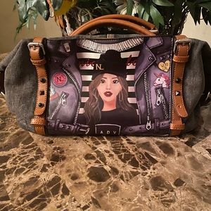 This is definitely a eye catching denim purse.